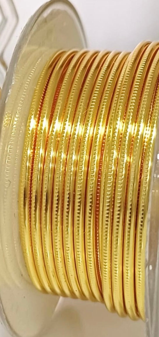 Gold-colored textured round wire, Hammered and Nidus model. AMERICRAFT SUPPLY brand. Collection 2024