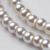 Hilos de perlas de cristal redondas color crema